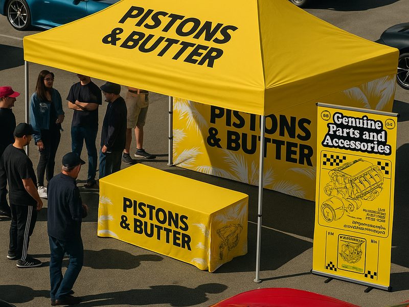Custom-printed event tent, table cover and banner at a car show